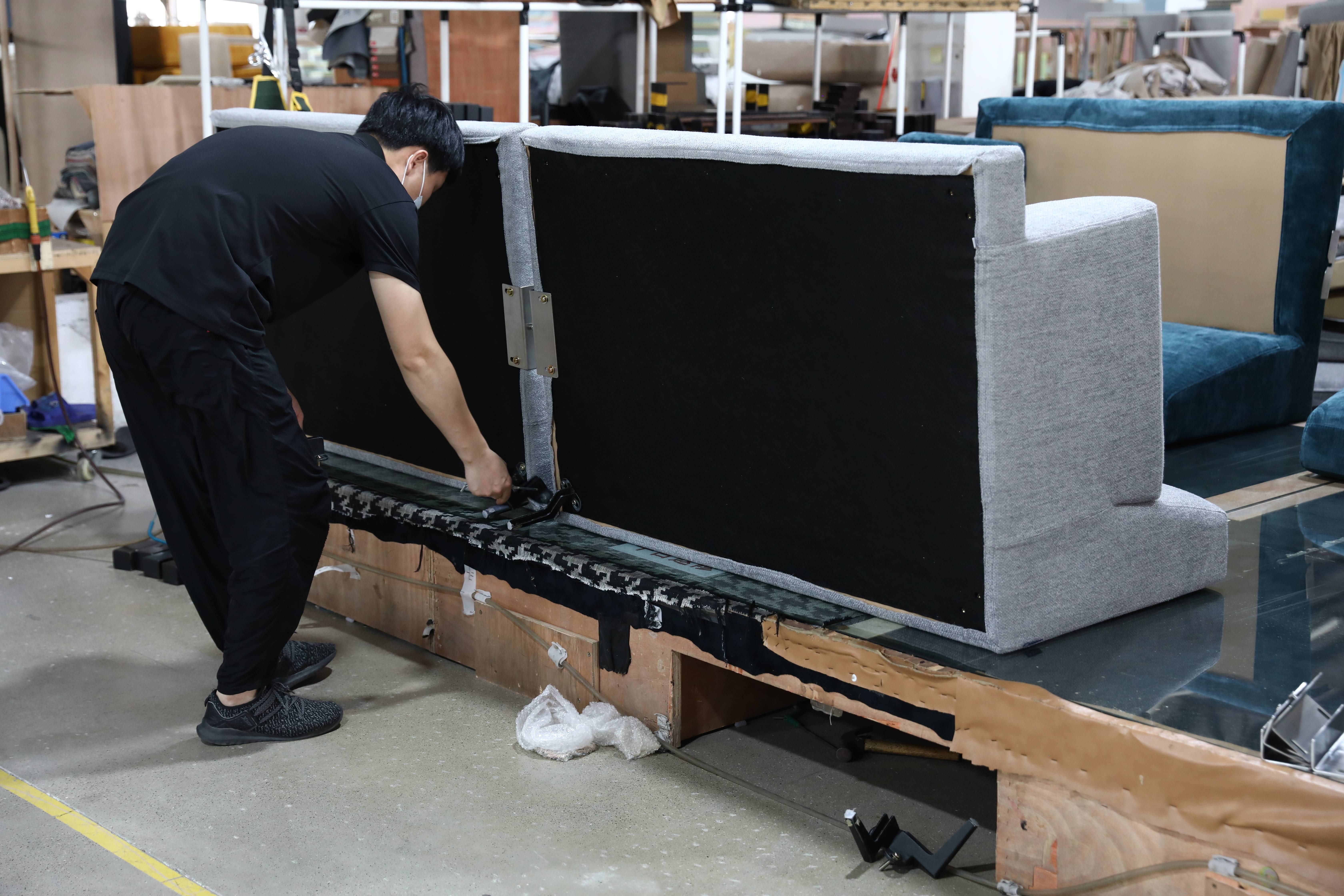 sofa leg installation in sofa factory